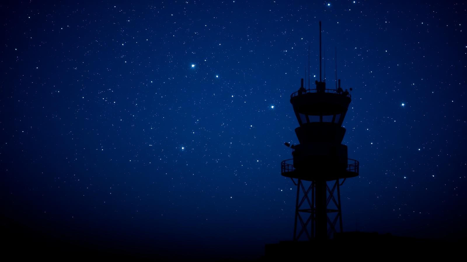 Aviation control tower under stars